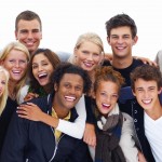 Group of smiling friends against white background